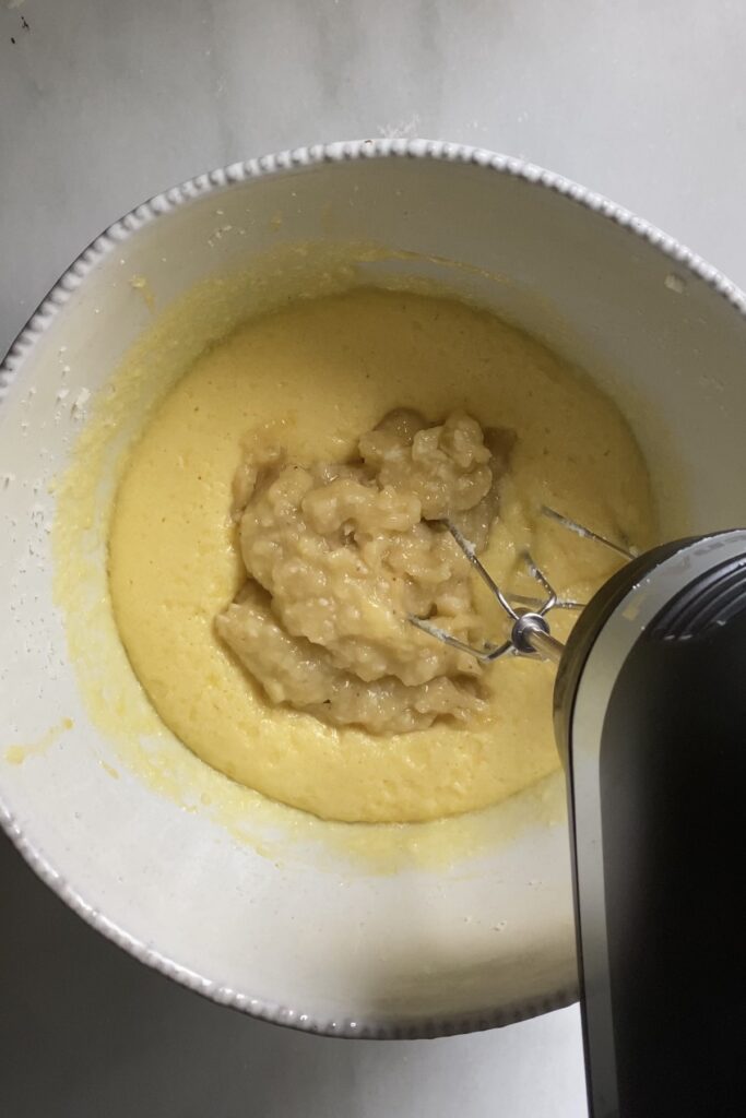 Adding mashed banana to batter