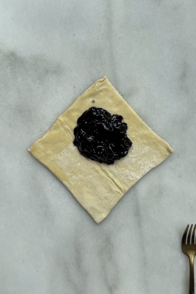 set, room temp blueberry filling on top of puff pastry square