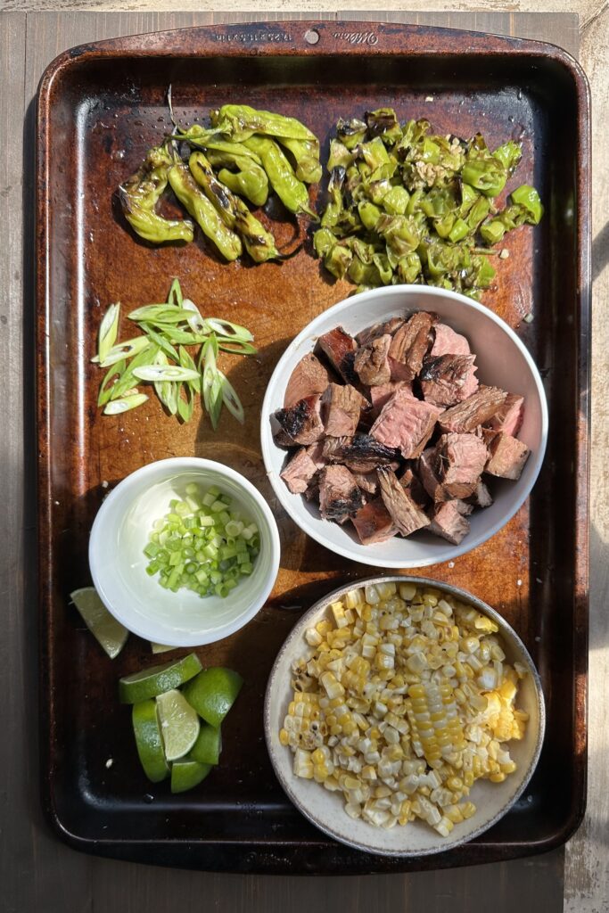 steak, shishito peppers & corn grilled & cut up for rice bowls