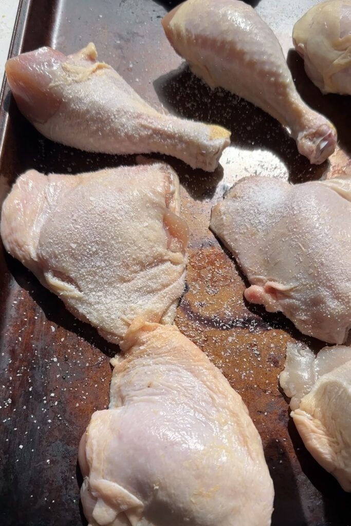 seasoning the chicken with salt